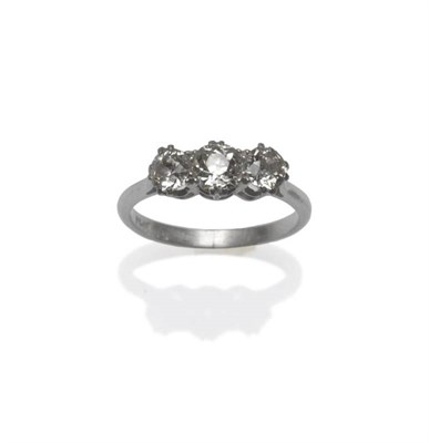 Lot 505 - A Diamond Three Stone Ring, the graduated old cut diamonds in white claw settings, to a tapered...