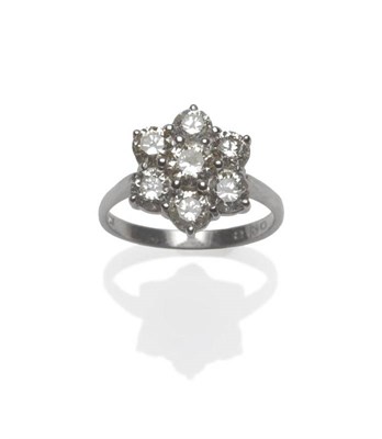 Lot 507 - A Diamond Cluster Ring, a round brilliant cut diamond within a border of six slightly smaller...