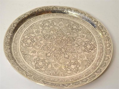 Lot 516 - A Persian White Metal Tray, probably Damascus, 19th century or earlier, circular, profusely...