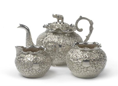 Lot 520 - An Indian White Metal Three Piece Teaset, circa 1880-1900, the globular body with waved everted...