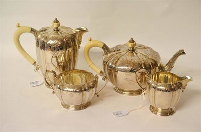 Lot 538 - A George V Silver Four Piece Teaset, Adie Bros Ltd, Birmingham 1917, the melon form body with ivory