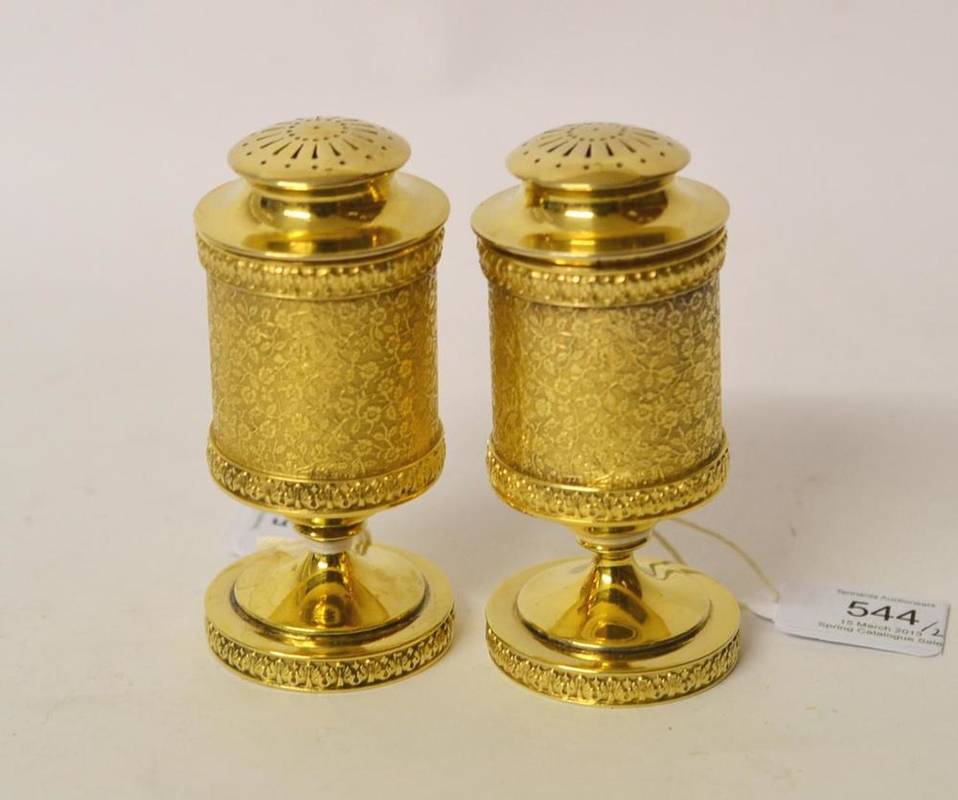 Lot 544 - A Pair of Edward VII Silver Gilt Pedestal Pepperettes, Sydney Bellamy Harman, London, 1906, the...
