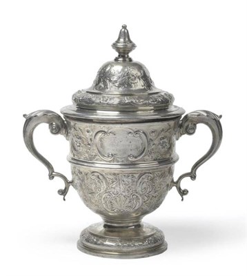 Lot 553 - A Victorian Silver Cup and Cover, Edward Barnard & Sons, London 1896, the pedestal foot rising to a