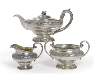 Lot 573 - A George IV Silver Three Piece Teaset, Benjamin Smith III, London 1827, the spreading foot...