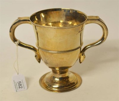 Lot 582 - A George III Silver Two-Handled Cup, maker's mark worn, London 1808, the pedestal foot rising...