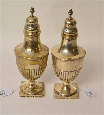 Lot 585 - A Pair of George III Silver Pepperettes, no maker's mark, London 1801, the square pedestal foot...