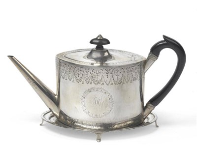 Lot 588 - A George III Silver Teapot and Stand, Benjamin Montague, London 1789, of oval form with wood scroll