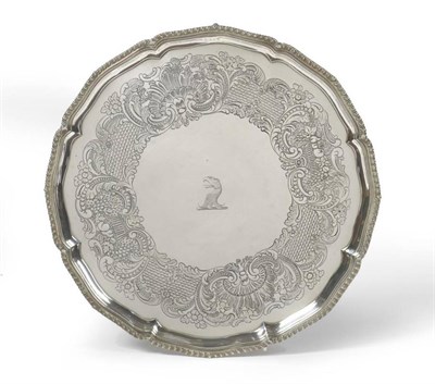 Lot 592 - A George III Silver Salver, John Carter, London 1775, shaped circular on four cast claw and...