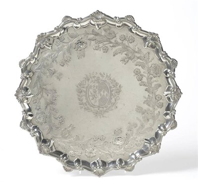 Lot 594 - A George III Silver Salver, Ebenezer Coker, London 1771, shaped circular, raised on four cast...