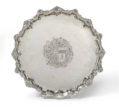 Lot 597 - A George III Silver Salver, Ebenezer Coker, London 1767, shaped circular raised on four cast...