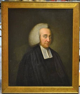 Lot 721 - English School (19th century) Portrait of a clergyman, standing, half length, wearing black...