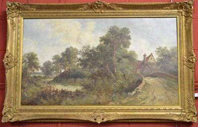 Lot 759 - Octavius Thomas Clark (1851-1921) Summer river landscape with cottages beside a stone bridge Signed