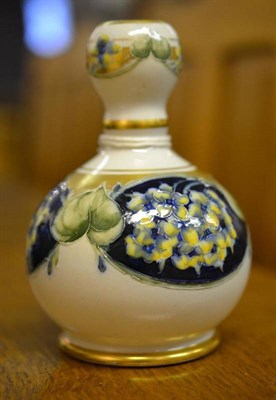 Lot 940 - A William Moorcroft Macintyre Lilac Pattern Double Gourd Vase, circa 1905, on a white ground...