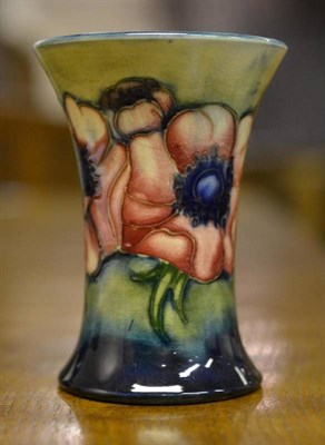 Lot 949 - A Walter Moorcroft Anemone Pattern Trumpet Vase, on a blue wash ground, impressed factory mark with