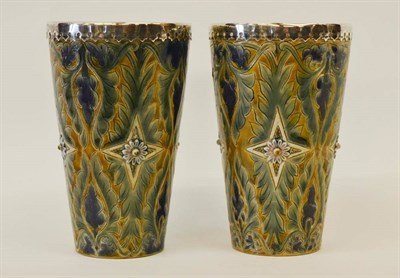 Lot 965 - A Pair of Doulton Lambeth Stoneware Beakers, by Frank Butler, incised and applied decoration,...