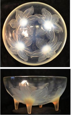 Lot 1009 - A René Lalique  "Lys " Opalescent and Clear Glass Bowl, the underside moulded with four lily...