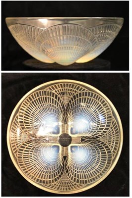 Lot 1011 - A René Lalique  "Coquilles " Opalescent and Clear Glass Bowl, No.3200, the underside moulded...