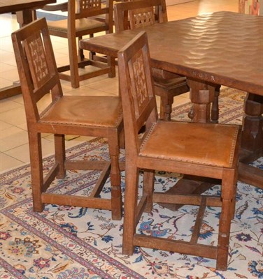 Lot 1044 - A Set of Ten Robert  "Mouseman " Thompson Oak Lattice Back Dining Chairs, with tan cow hide...