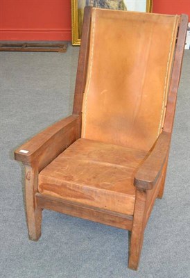 Lot 1046 - A Robert  "Mouseman " Thompson Oak Smoker's Chair, with slung leather back, cow hide covered...