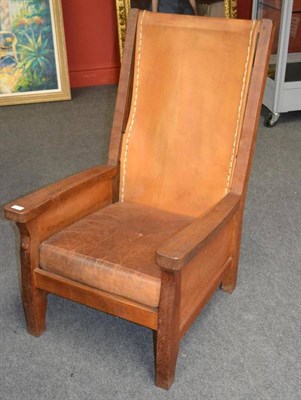 Lot 1049 - A Robert  "Mouseman " Thompson Oak Smoker's Chair, with slung leather back, cow hide covered...