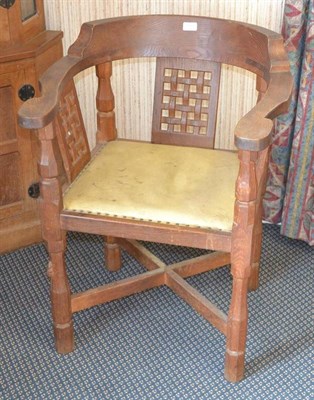 Lot 1051 - A Robert  "Mouseman " Thompson Oak Monk's Chair, with curved back and shaped arms, over three...