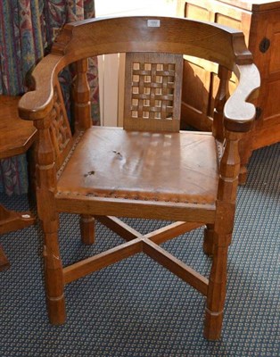 Lot 1052 - A Robert  "Mouseman " Thompson Oak Monk's Chair, with curved back and shaped arms, over three...