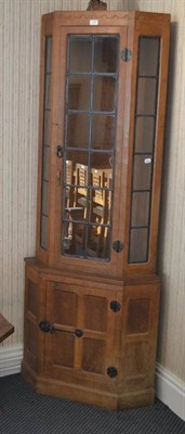 Lot 1053 - A Robert  "Mouseman " Thompson Oak Corner Display Cupboard, penny moulded frieze, the upper section