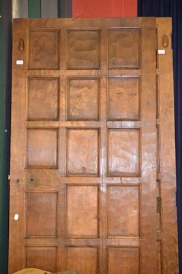 Lot 1057 - A Pair of Robert  "Mouseman " Thompson Panelled Oak Doors, each with eighteen panels, both with...