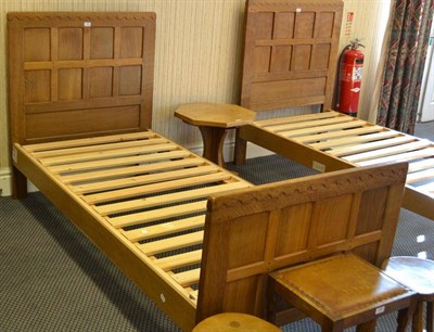 Lot 1059 - A Robert  "Mouseman " Thompson Oak 3' Single Panelled Bedstead, the panelled headboard and...