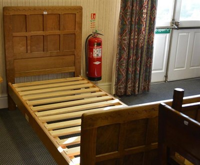 Lot 1060 - A Robert  "Mouseman " Thompson Oak 3' Single Panelled Bedstead, the panelled headboard and...