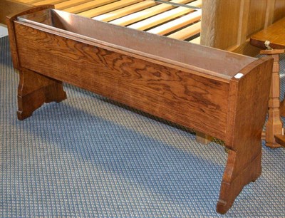 Lot 1065 - A Robert  "Mouseman " Thompson 4' Oak Planter with Liner, of rectangular form with shaped end...