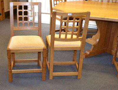 Lot 1081 - A Set of Eight Old Mill Furniture Oak Lattice Back Chairs, drop-in seats, on two turned...