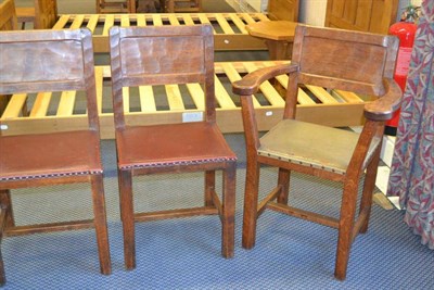 Lot 1088 - A Set of Six (5+1) Kingpost Oak Panel Back Chairs, nailed hide seats, on four square section...