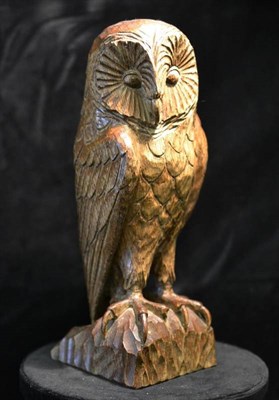 Lot 1091 - A Yorkshire School Carved Oak Owl, carved as a perched owl on a rock work base, unmarked, 25cm...