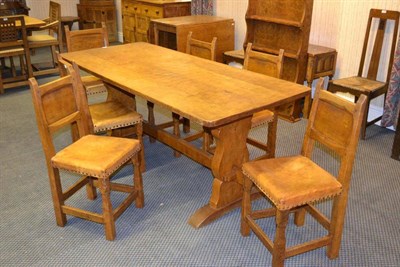 Lot 1093 - A Thomas  "Gnomeman " Whittaker Oak 6' Four Plank Refectory Table, on shaped supports joined by...