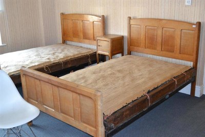 Lot 1095 - A Pair of English Oak 4' Panelled Beds, designed by Gordon Russell, the headboards with shaped...