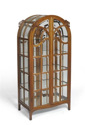 Lot 1106 - A French Art Nouveau Carved Walnut Glazed Cabinet, in the style of Louis Majorelle/Eugene Gaillard