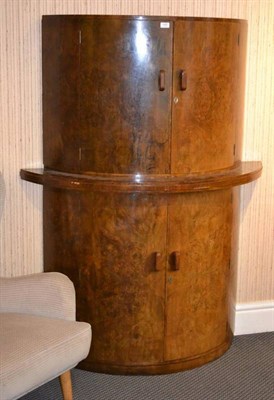 Lot 1107 - An Art Deco Walnut and Satin Birch Bowfront Cocktail Cabinet, by G & F, the two upper doors...