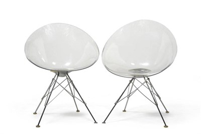 Lot 1118 - A Pair Eros Transparent Plastic Chairs, designed by Philippe Starck for Kartell, on tubular...