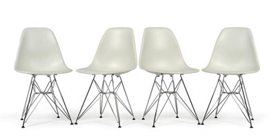 Lot 1119 - A Set of Four Plastic DAR Chairs, designed by Charles and Ray Eames for Vitra, on tubular metal...