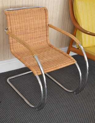 Lot 1122 - A Modern Ludwig Miles van der Rohe MR20 Armchair, chrome bent tubular steel frame with woven...