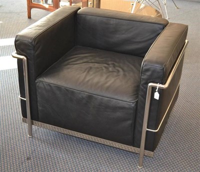 Lot 1123 - A Modern Le Corbusier LC2 Club Chair, polished chromed steel frame with black leather cushions,...