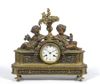 Lot 1153 - A French Gilt Bronze Striking Mantel Clock, signed F L Hausburg a Paris, circa 1870, surmounted...