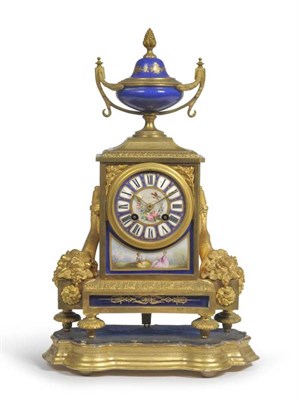 Lot 1163 - A French Ormolu and Porcelain Mounted Striking Mantel Clock, circa 1880, with urn finial, porcelain