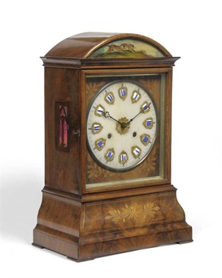 Lot 1188 - A Black Forest Walnut Inlaid Striking Automata Table Clock, stamped S Kamerer Furtwangen, circa...