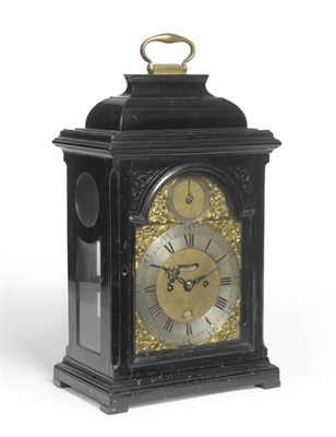 Lot 1197 - An Ebonised Striking Table Clock, inverted bell top with carrying handle, side viewing windows,...