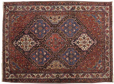 Lot 1238 - Good Bakhtiari Carpet  West Persia The lozenge field with a lattice of polychrome medallions framed