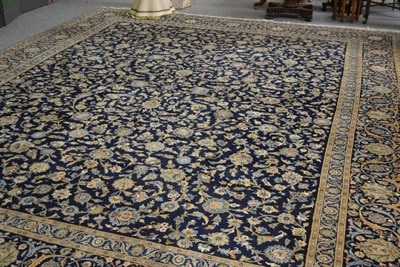 Lot 1239 - Kashan Carpet Central Persia The deep indigo field with an allover design of palmettes and...