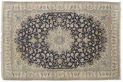 Lot 1251 - Isfahan Part Silk Carpet Central Persia The indigo field of rich scrolling vines and palmettes...