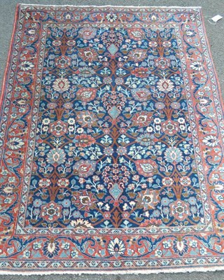 Lot 1256 - Tabriz Rug Persian Azerbaijan The soft indigo field of large palmettes and flowering vines...